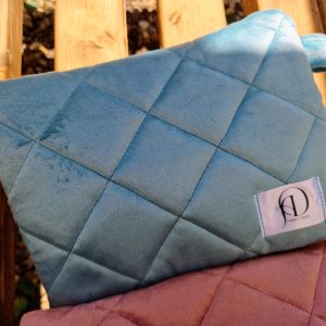 Flat lay of a Misty Aqua velvet Kindle pouch from the Velvet Embrace collection, featuring a calming duck egg blue tone with a gold heart cotton lining. Handmade in the UK.