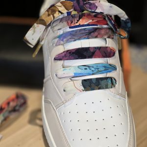 Nature inspired leaf pattern handmade shoelaces styled on sneakers.